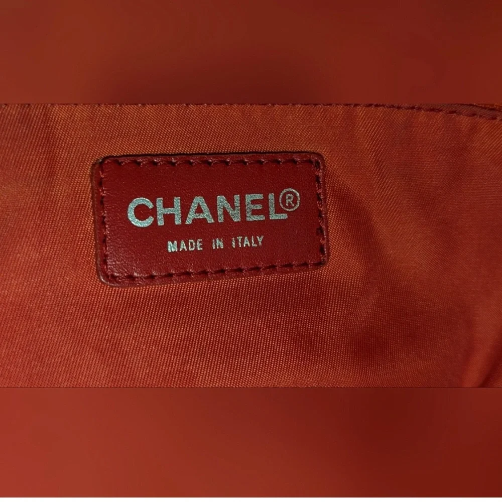 CHANEL Red Quilted Tote Bag with Embossed Logo
